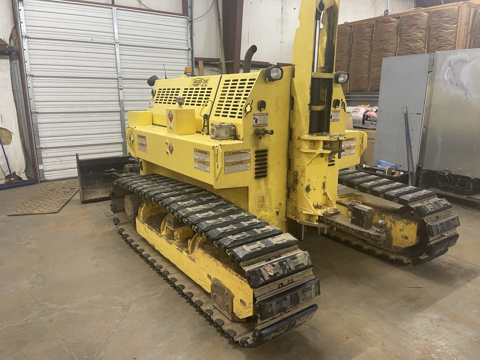 A tracked house tug used to move mobile homes