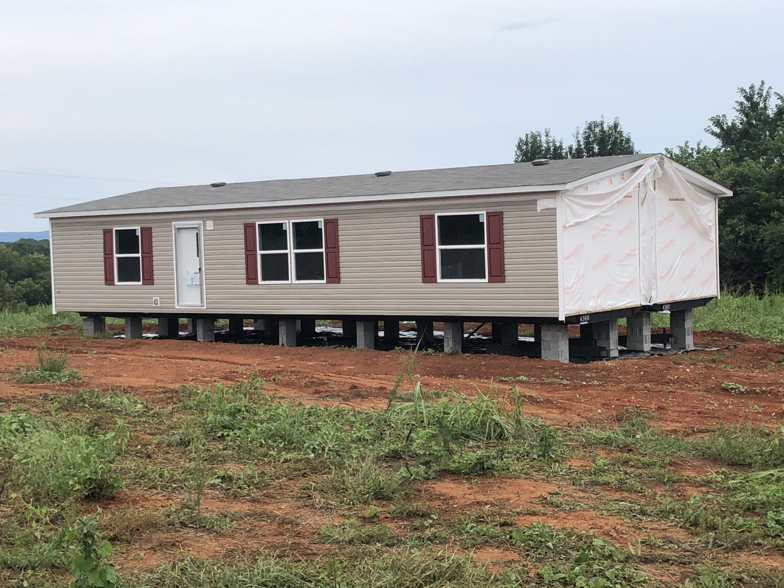 Double-wide set on blocks in a field