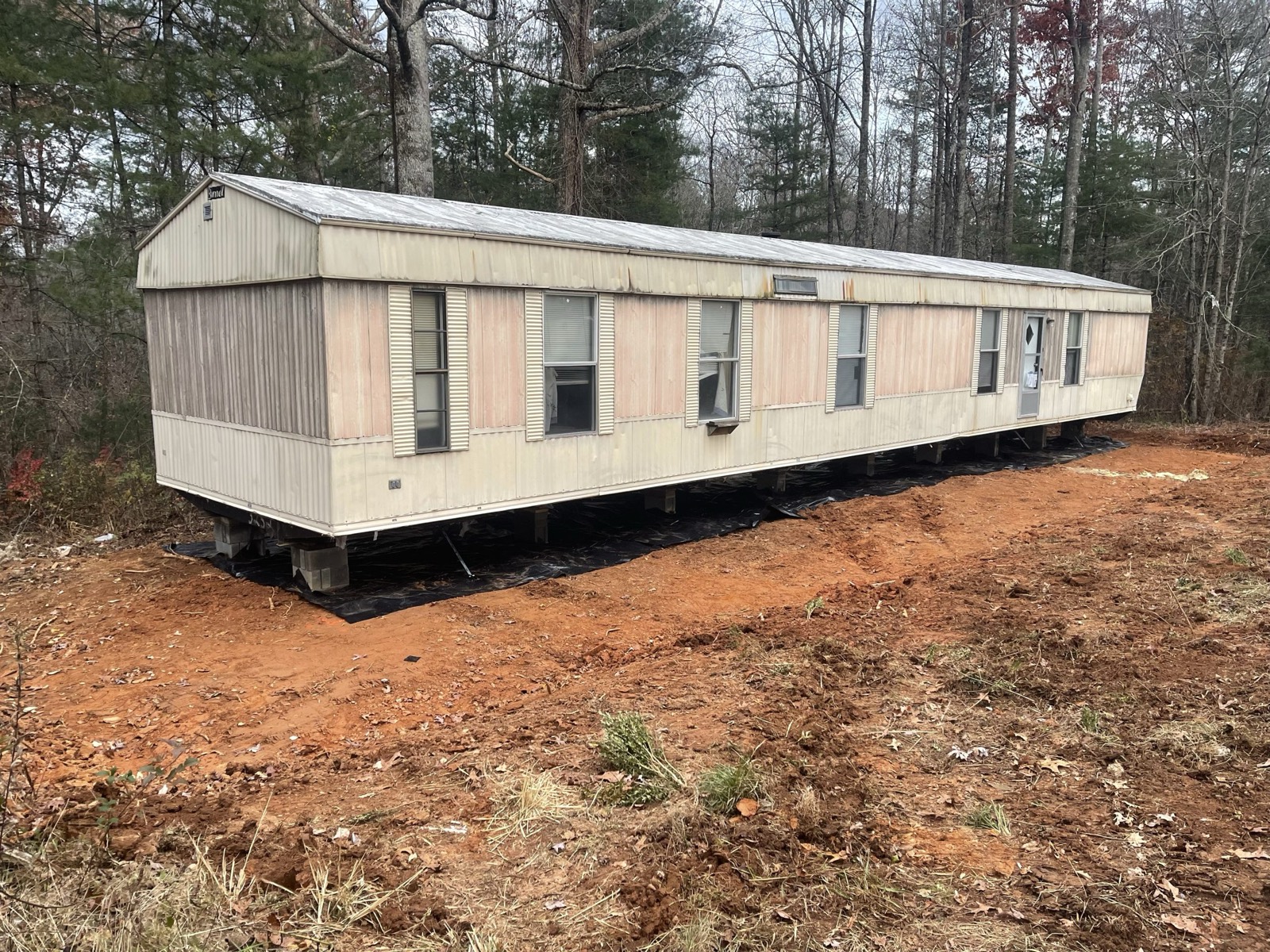 A used single-wide home staged for inspection